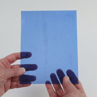 Video of the Mid Blue glass plate in transparent blue, 15x19cm, held up and tilted to show its pattern and transparency