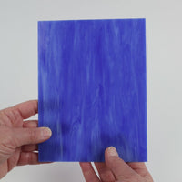 Video of the Mid Blue glass plate in translucent blue, 15x19cm, held up and tilted to show its pattern and transparency