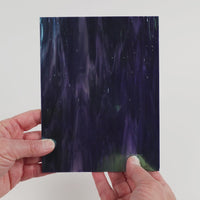 Video of the Midnight Pearl glass plate in iridescent translucent blue, 15x19cm, held up and tilted to show its pattern and transparency