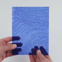 Video of the Cobalt Ripple glass plate in transparent blue, 15x19cm, held up and tilted to show its pattern and transparency