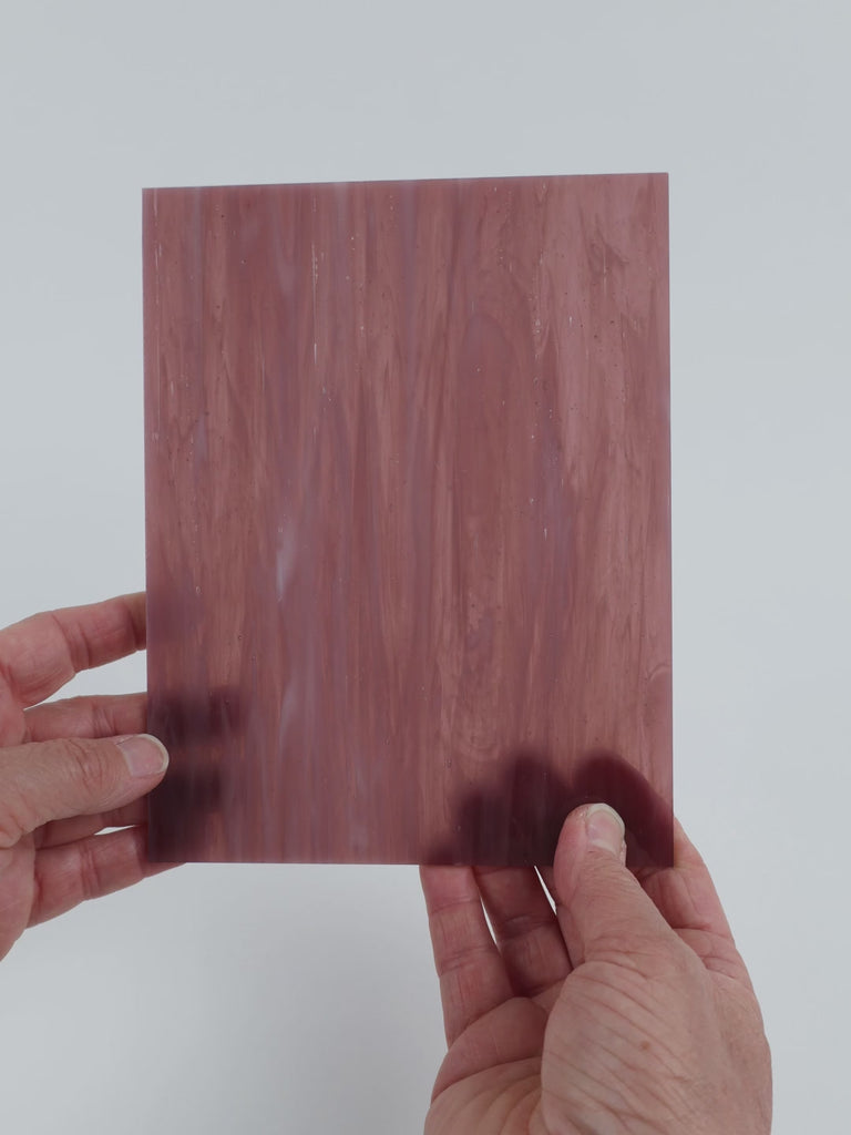 Video of the Shrinking Violet glass plate in translucent purple, 15x19cm, held up and tilted to show its pattern and transparency